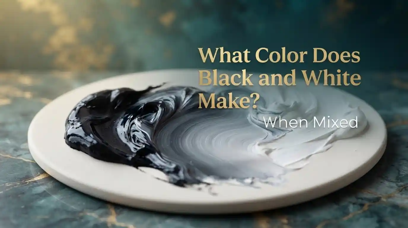 Black and white paint mixed together to create different shades of gray on a color palette.